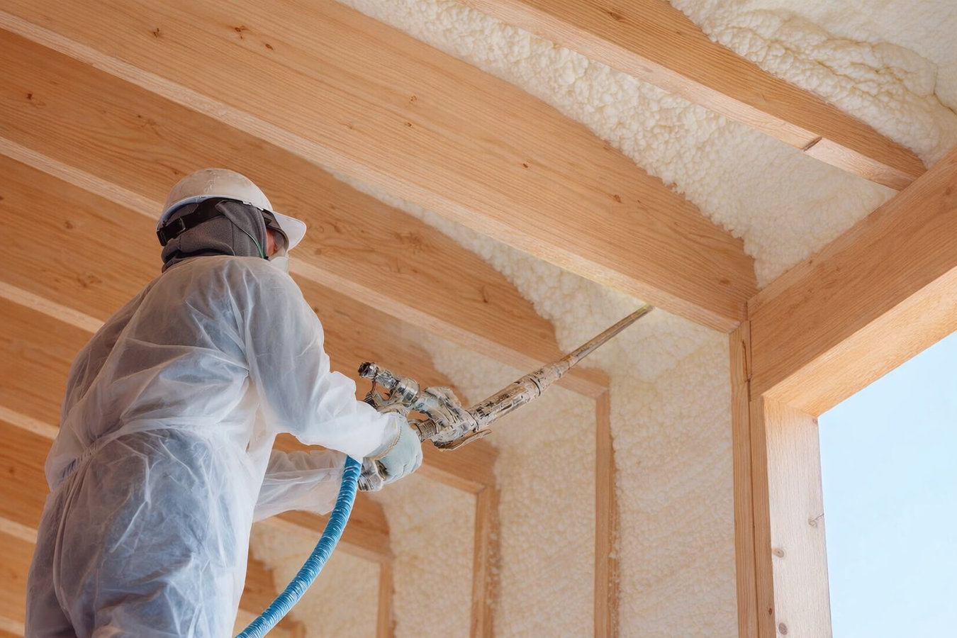 Insulation contractor working in a Burlington, VT home
